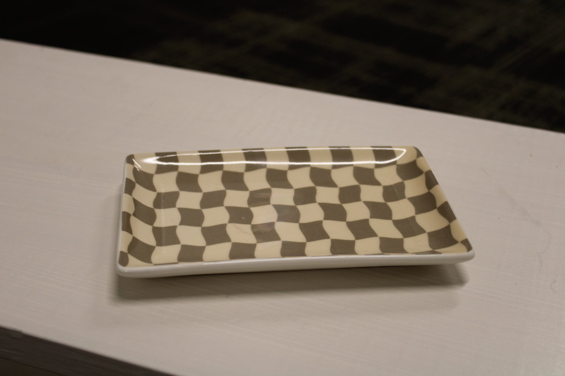 Tan and gray checkered decorative dish