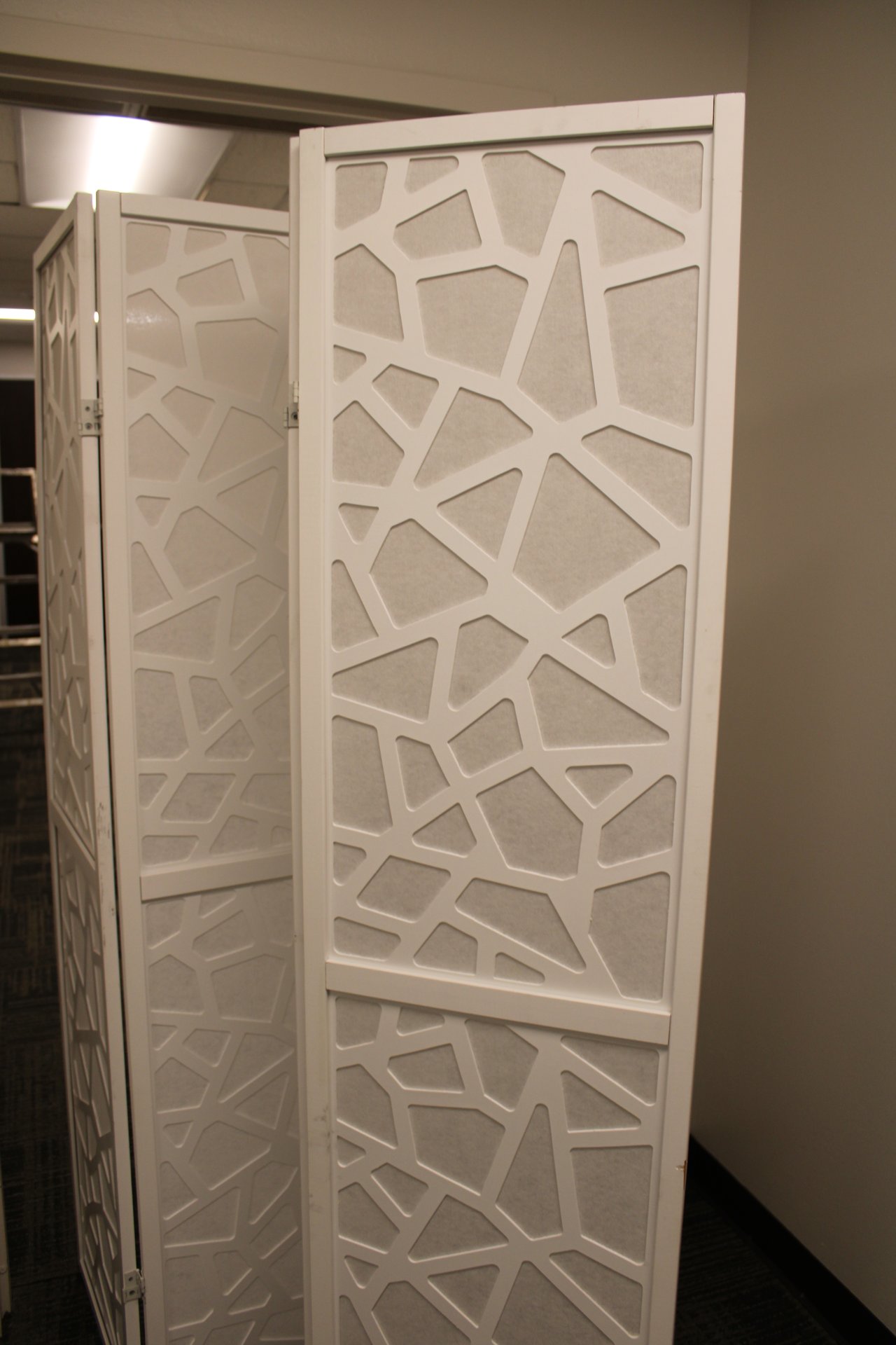 Big tall white cabinets with black handles